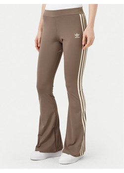 adidas Legginsy JD4601 Beżowy Flare Fit ze sklepu MODIVO w kategorii Spodnie damskie - zdjęcie 182707575