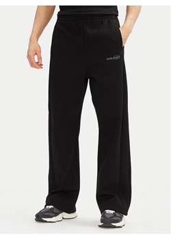Karl Kani Spodnie dresowe Ellipse 60060044 Czarny Straight Leg ze sklepu MODIVO w kategorii Spodnie męskie - zdjęcie 182709607