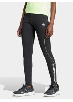 adidas Legginsy Graphic IT9700 Czarny Slim Fit ze sklepu MODIVO w kategorii Spodnie damskie - zdjęcie 182713208