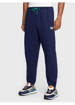 Fila Spodnie dresowe Tricase FAM0153 Granatowy Oversize ze sklepu MODIVO w kategorii Spodnie męskie - zdjęcie 182713437