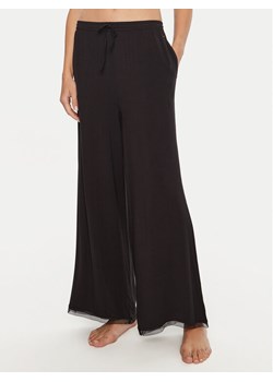 Tommy Hilfiger Spodnie piżamowe UW0UW05575 Czarny Relaxed Fit ze sklepu MODIVO w kategorii Piżamy damskie - zdjęcie 182714018