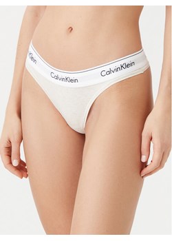 Calvin Klein Underwear Stringi 0000F3786E Beżowy ze sklepu MODIVO w kategorii Majtki damskie - zdjęcie 182714668