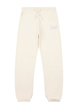 Lee Spodnie dresowe Wobbly Graphic LEG5001 Beżowy ze sklepu MODIVO w kategorii Spodnie dziewczęce - zdjęcie 182714906