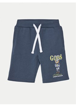 Guess Szorty materiałowe N5RD03 KAD74 Granatowy Relaxed Fit ze sklepu MODIVO w kategorii Spodenki chłopięce - zdjęcie 182715285