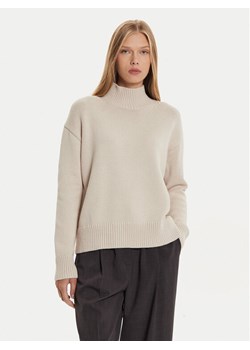Calvin Klein Golf K20K207437 Beżowy Regular Fit ze sklepu MODIVO w kategorii Swetry damskie - zdjęcie 182716807