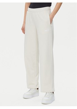 Puma Spodnie dresowe Ess Small No. 1 Logo 684979 Beżowy Straight Fit ze sklepu MODIVO w kategorii Spodnie damskie - zdjęcie 182717075