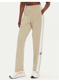 adidas Spodnie dresowe Adibreak IY2130 Beżowy Loose Fit ze sklepu MODIVO w kategorii Spodnie damskie - zdjęcie 182717437
