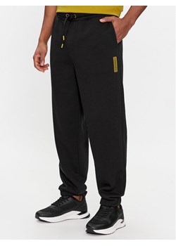 Calvin Klein Spodnie dresowe Grid Logo K10K112430 Czarny Relaxed Fit ze sklepu MODIVO w kategorii Spodnie męskie - zdjęcie 182718915