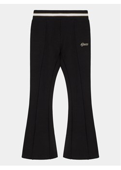 Guess Spodnie materiałowe J4RB00 KAUH0 Czarny Regular Fit ze sklepu MODIVO w kategorii Spodnie dziewczęce - zdjęcie 182719846