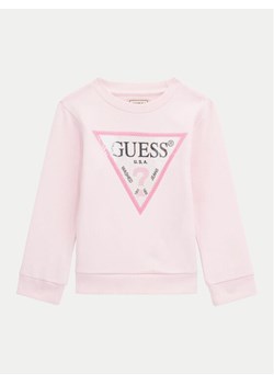 Guess Bluza K4YQ10 KA6R3 Różowy Regular Fit ze sklepu MODIVO w kategorii Bluzy dziewczęce - zdjęcie 182720017