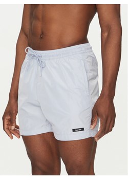 Calvin Klein Swimwear Szorty kąpielowe KM0KM01111 Niebieski Regular Fit ze sklepu MODIVO w kategorii Kąpielówki - zdjęcie 182722196