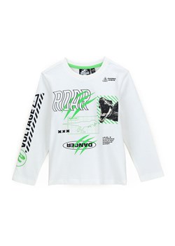Original Marines Bluzka JURASSIC WORLD DCAV2627B Biały Regular Fit ze sklepu MODIVO w kategorii T-shirty chłopięce - zdjęcie 182722259