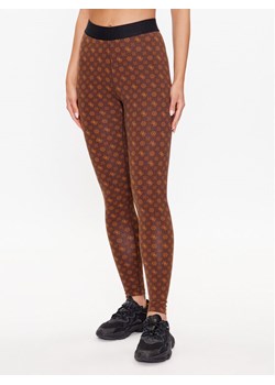 Guess Legginsy V3YB01 MC04N Brązowy Slim Fit ze sklepu MODIVO w kategorii Spodnie damskie - zdjęcie 182729799
