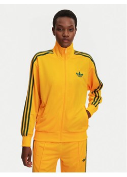 adidas Bluza adicolor Classic Firebird JP2300 Żółty Loose Fit ze sklepu MODIVO w kategorii Bluzy damskie - zdjęcie 182731166