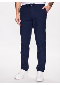 Lindbergh Spodnie materiałowe 30-008003 Niebieski Tapered Fit ze sklepu MODIVO w kategorii Spodnie męskie - zdjęcie 182731587