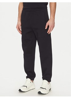 Armani Exchange Spodnie dresowe XM000354 AF10818 UB101 Granatowy Regular Fit ze sklepu MODIVO w kategorii Spodnie męskie - zdjęcie 182740607