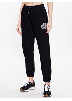Ellesse Spodnie dresowe Jigono SGR17954 Czarny Regular Fit ze sklepu MODIVO w kategorii Spodnie damskie - zdjęcie 182742218