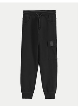 Coccodrillo Spodnie dresowe WC5120102VBA Czarny Regular Fit ze sklepu MODIVO w kategorii Spodnie chłopięce - zdjęcie 182743177