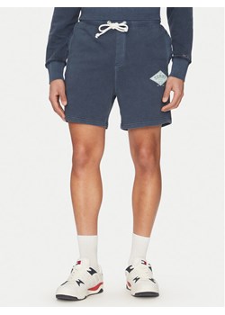 Tommy Jeans Szorty sportowe Varsity DM0DM20936 Granatowy Regular Fit ze sklepu MODIVO w kategorii Spodenki męskie - zdjęcie 182744295