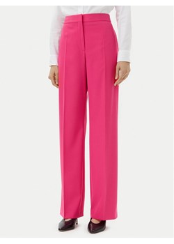 HUGO Spodnie materiałowe Hambali 50537611 Różowy Relaxed Fit ze sklepu MODIVO w kategorii Spodnie damskie - zdjęcie 182744716