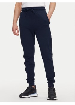 HUGO Spodnie dresowe Liam 50540918 Granatowy Regular Fit ze sklepu MODIVO w kategorii Spodnie męskie - zdjęcie 182746245
