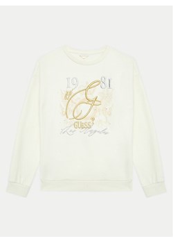 Guess Bluza J4BQ05 KAV34 Écru Regular Fit ze sklepu MODIVO w kategorii Bluzy dziewczęce - zdjęcie 182746989