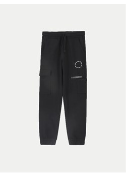 Coccodrillo Spodnie dresowe ZC4120201DBJ Czarny Slim Fit ze sklepu MODIVO w kategorii Spodnie chłopięce - zdjęcie 182747068