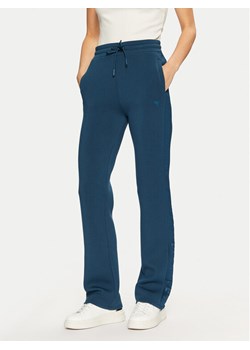 Guess Spodnie dresowe V3RB21 K7UW2 Niebieski Regular Fit ze sklepu MODIVO w kategorii Spodnie damskie - zdjęcie 182748839