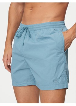 Calvin Klein Swimwear Szorty kąpielowe KM0KM01080 Niebieski Regular Fit ze sklepu MODIVO w kategorii Kąpielówki - zdjęcie 182749836