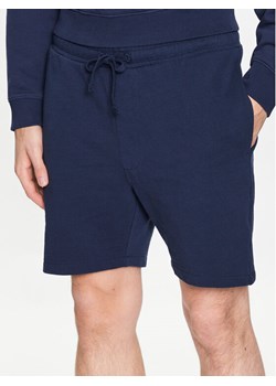 Tommy Jeans Szorty sportowe College DM0DM16331 Granatowy Regular Fit ze sklepu MODIVO w kategorii Spodenki męskie - zdjęcie 182753538