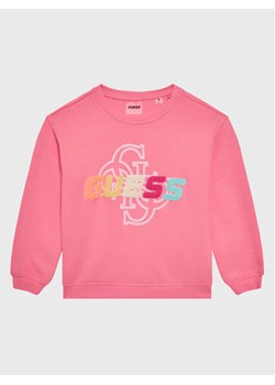Guess Bluza J3GQ08 FL04P Różowy Regular Fit ze sklepu MODIVO w kategorii Bluzy dziewczęce - zdjęcie 182753848