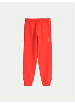 Coccodrillo Spodnie dresowe WC5120101VBA Czerwony Regular Fit ze sklepu MODIVO w kategorii Spodnie dziewczęce - zdjęcie 182754065