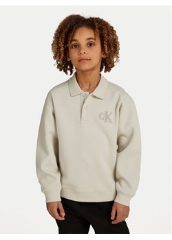 Calvin Klein Jeans Bluza IB0IB02231 Beżowy Regular Fit ze sklepu MODIVO w kategorii Bluzy chłopięce - zdjęcie 182755587