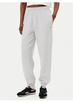 Reebok Spodnie dresowe 100221467 Szary Regular Fit ze sklepu MODIVO w kategorii Spodnie damskie - zdjęcie 182756039