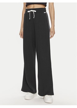 Tommy Hilfiger Spodnie dresowe UW0UW05237 Granatowy Relaxed Fit ze sklepu MODIVO w kategorii Spodnie damskie - zdjęcie 182756296