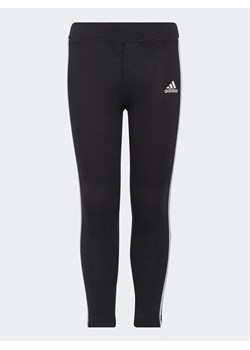 adidas Legginsy Essentials 3-Stripes Leggings H65800 Czarny Fitted Fit ze sklepu MODIVO w kategorii Spodnie dziewczęce - zdjęcie 182760366