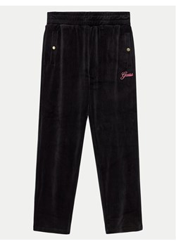 Guess Spodnie dresowe J4BQ13 KCH92 Czarny Relaxed Fit ze sklepu MODIVO w kategorii Spodnie chłopięce - zdjęcie 182760959
