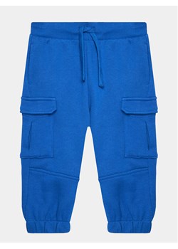 United Colors Of Benetton Spodnie dresowe 3J68GF034 Niebieski Regular Fit ze sklepu MODIVO w kategorii Spodnie chłopięce - zdjęcie 182761975