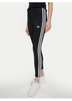 adidas Legginsy Essentials 3-Stripes High-Waisted Single Jersey Leggings IC7151 Czarny ze sklepu MODIVO w kategorii Spodnie damskie - zdjęcie 182763138
