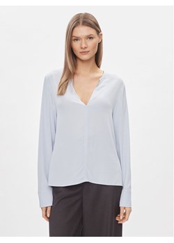 Tommy Hilfiger Bluzka WW0WW40529 Błękitny Relaxed Fit ze sklepu MODIVO w kategorii Bluzki damskie - zdjęcie 182763815