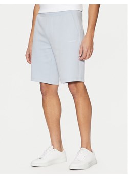 Calvin Klein Szorty sportowe Micro Logo K10K111208 Niebieski Regular Fit ze sklepu MODIVO w kategorii Spodenki męskie - zdjęcie 182765047