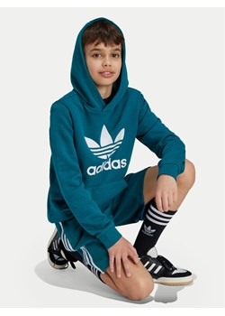 adidas Bluza Trefoil IY7440 Turkusowy Regular Fit ze sklepu MODIVO w kategorii Bluzy chłopięce - zdjęcie 182765876