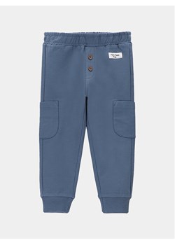 Coccodrillo Spodnie dresowe WC4120102DEN Niebieski Regular Fit ze sklepu MODIVO w kategorii Spodnie i półśpiochy - zdjęcie 182766039