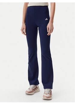 adidas Legginsy Essentials Small Logo JD3073 Granatowy Flare Fit ze sklepu MODIVO w kategorii Spodnie damskie - zdjęcie 182766555