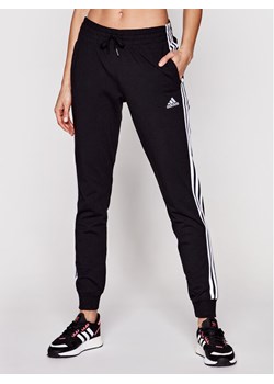 adidas Spodnie dresowe 3-Stripes GM5542 Czarny Slim Fit ze sklepu MODIVO w kategorii Spodnie damskie - zdjęcie 183550525