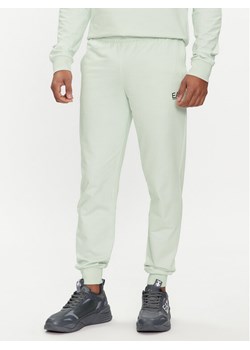 EA7 Emporio Armani Spodnie dresowe 8NPP53 PJ05Z 1133 Zielony Slim Fit ze sklepu MODIVO w kategorii Spodnie męskie - zdjęcie 183578535