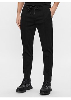Boss Spodnie dresowe Hadiko Mirror 50505320 Czarny Regular Fit ze sklepu MODIVO w kategorii Spodnie męskie - zdjęcie 183602958