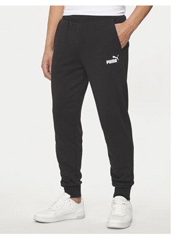 Puma Spodnie dresowe Ess Logo 586716 Czarny Regular Fit ze sklepu MODIVO w kategorii Spodnie męskie - zdjęcie 183612429