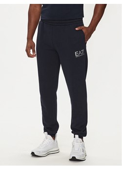 EA7 Emporio Armani Spodnie dresowe 6DPP59 PJSHZ 1562 Granatowy Regular Fit ze sklepu MODIVO w kategorii Spodnie męskie - zdjęcie 183613139