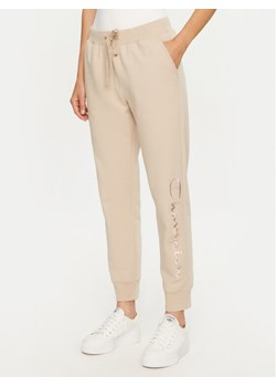 Champion Spodnie dresowe 117584 Beżowy Slim Fit ze sklepu MODIVO w kategorii Spodnie damskie - zdjęcie 183620508